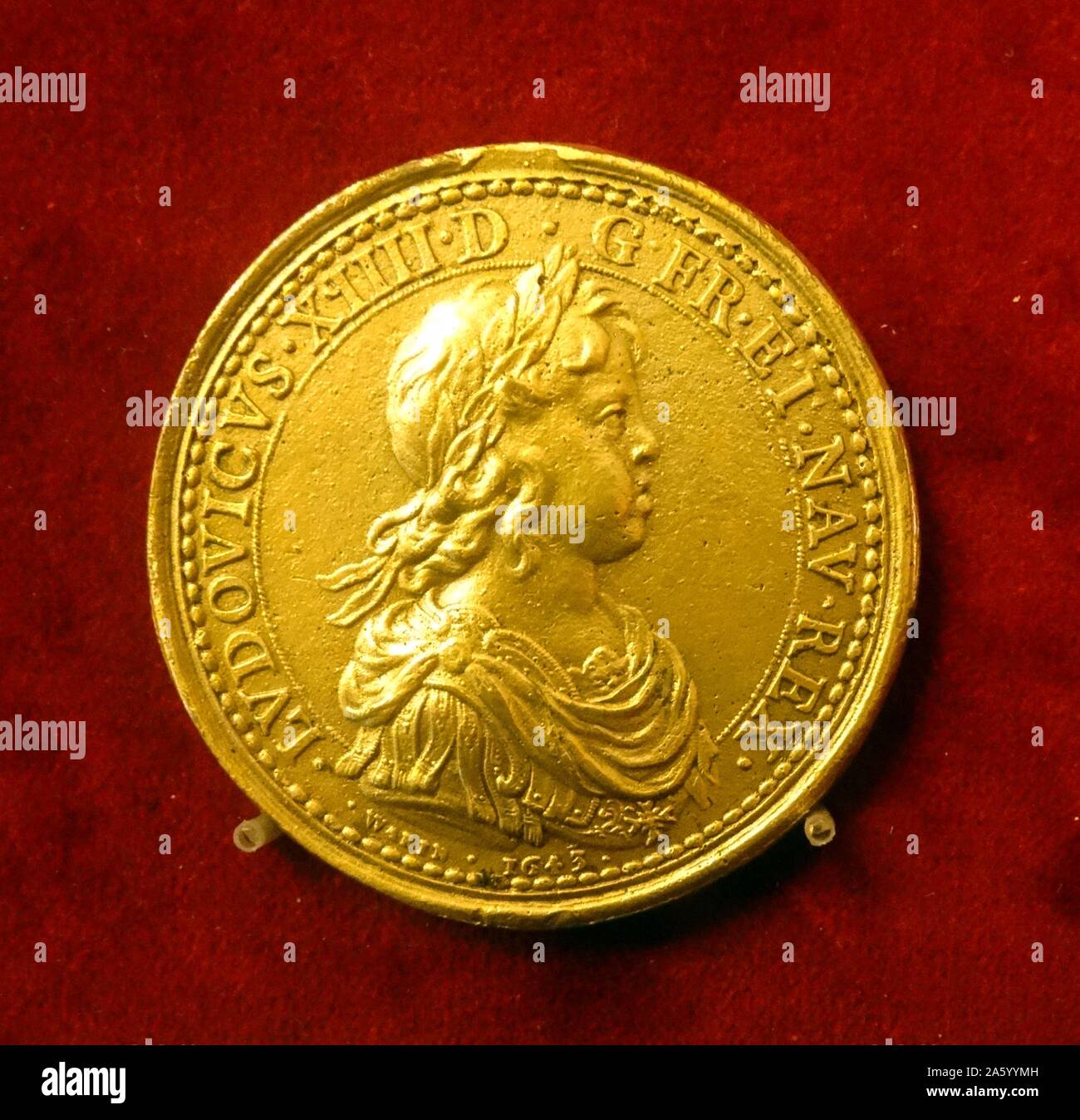 Gilt bronze coin depicting Louis XIII of France by Guillaume Dupré (1576-1643) French sculptor and medalist. Dated 17th Century Stock Photo