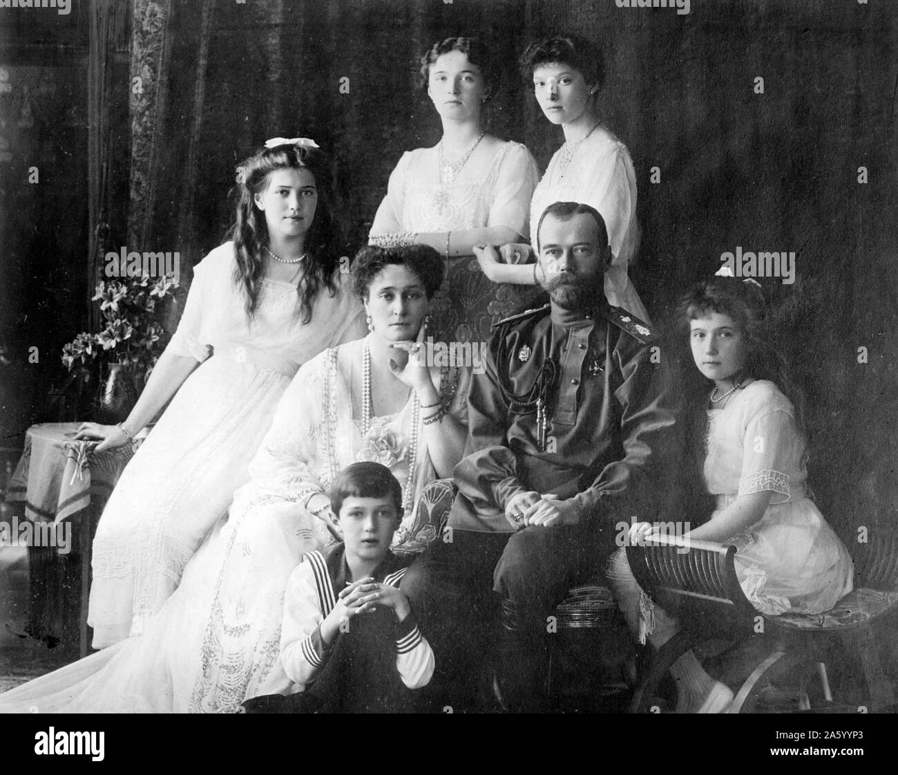 Photograph of the Romanov Family (left to right) Marie, Queen Alexandra, Czar Nicholas II, Anastasia, Alexei (front), and standing (left to right), Olga and Tatiana. Dated 1914 Stock Photo