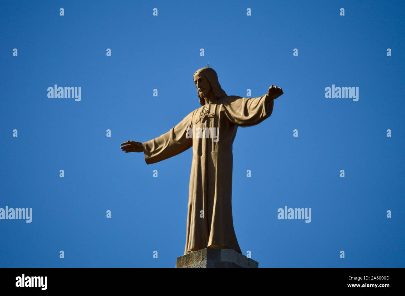 The statue of Jesus Christ on top of Sagrat Cor church at Tibidabo in Barcelona, Spain Stock Photo