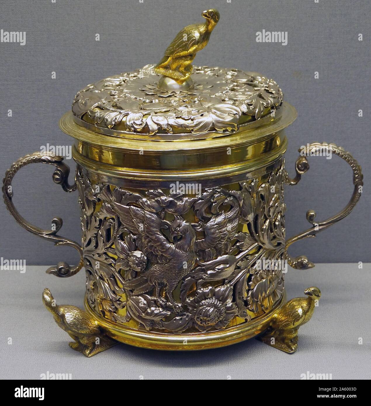 Two-handled cup and cover, made from silver and silver gilt and is embossed, chased and pierced. Dated 1670 Stock Photo