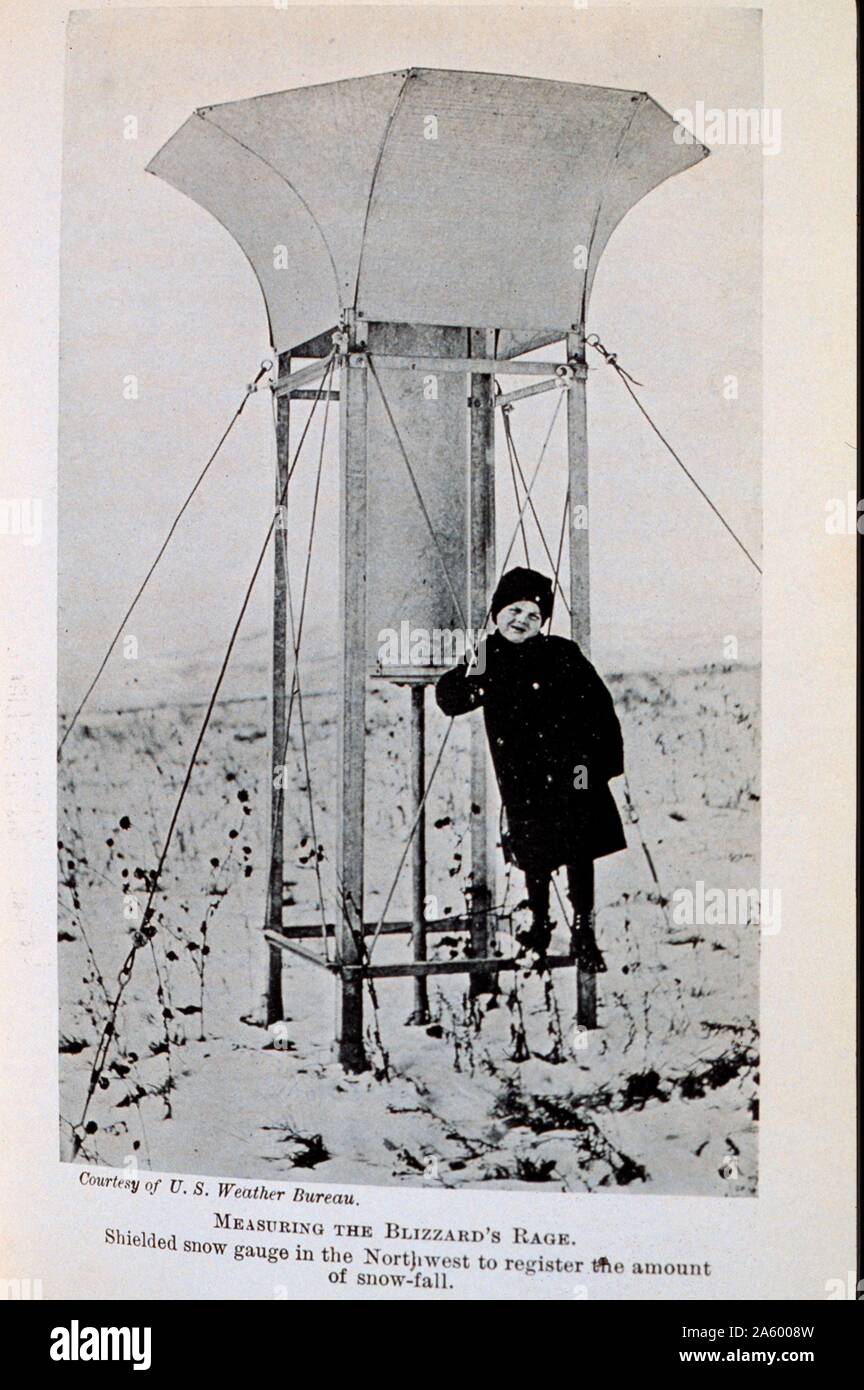 Measuring the Blizzard's Rage. Shielded snow gauge in the Northwest to register snow-fall. In: 'The Boy with the U.S. Weather Men', 1917 Stock Photo
