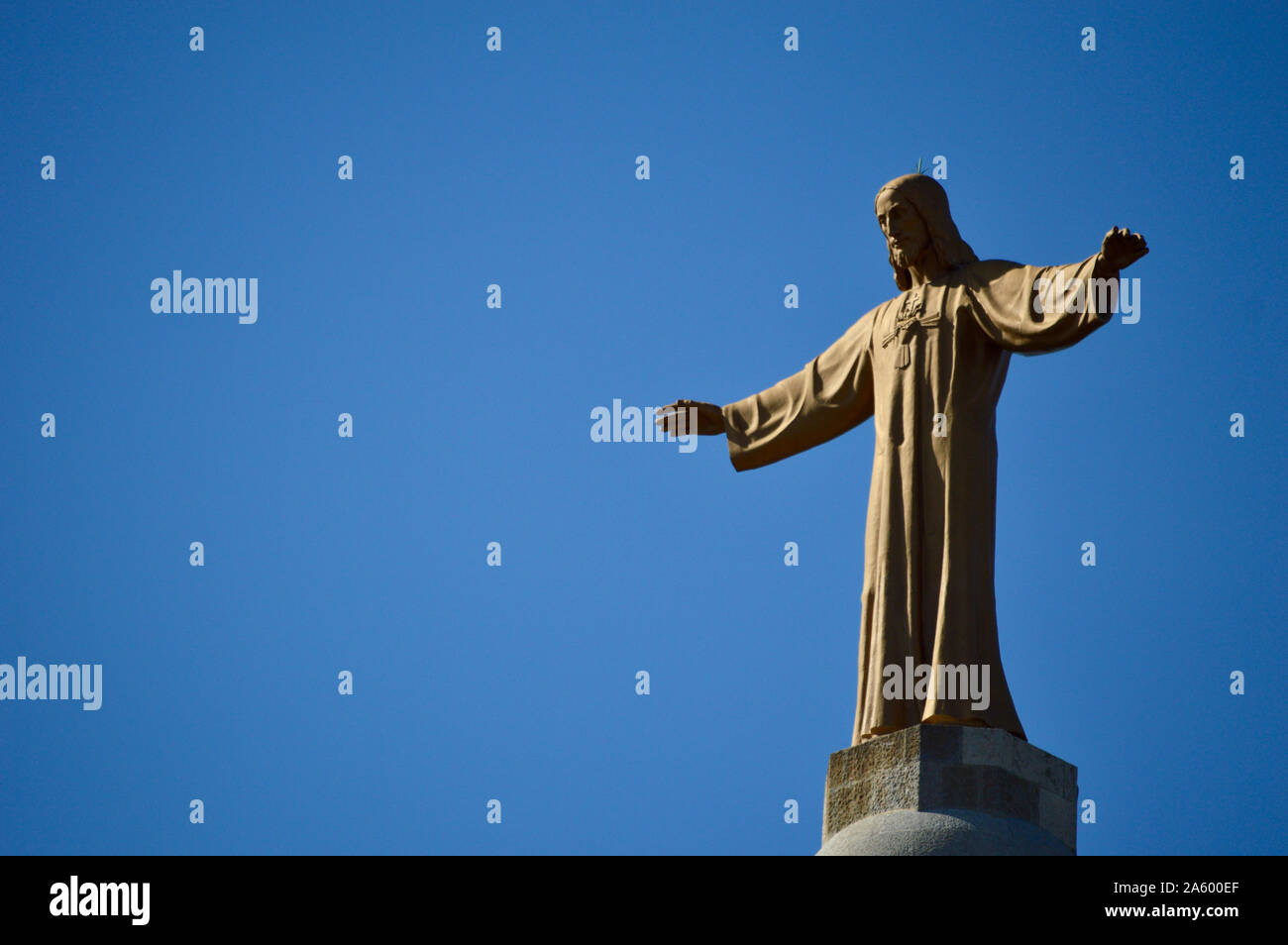 The statue of Jesus Christ on top of Sagrat Cor church at Tibidabo in Barcelona, Spain Stock Photo