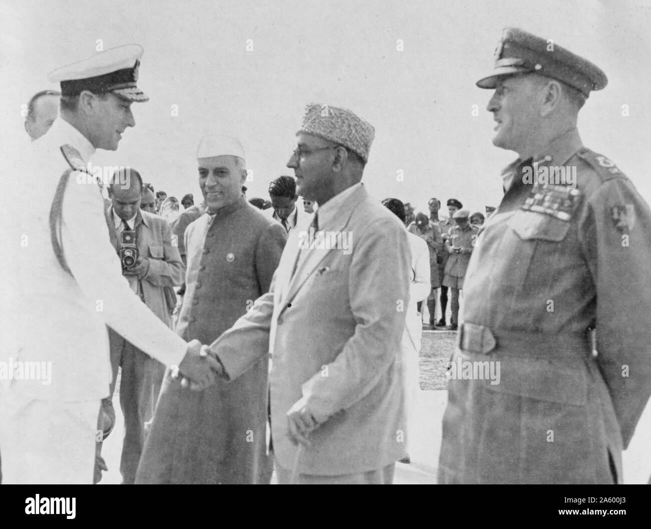 March, 1947. Lord Mountbatten, Viceroy of India, on arrival at Palam airfield; introduced by ;George Abell to Pandit Jawaharlal Nehru, ;Liaquat Ali Khan and Field-Marshal Sir Claude Auchinleck Stock Photo
