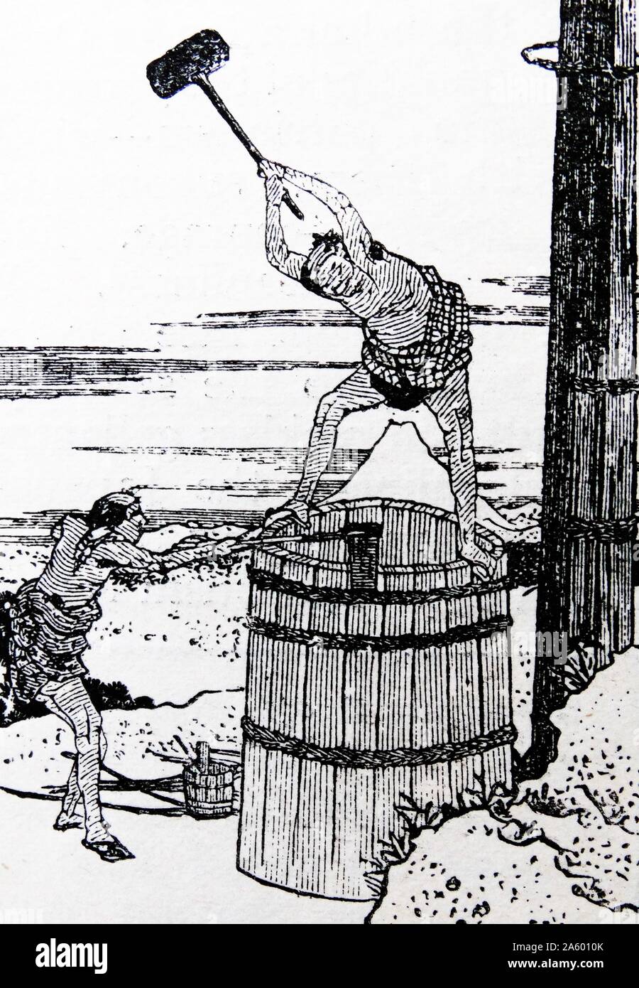 Japanese woodcut depicting coopers making a large barrel; 19th century Stock Photo