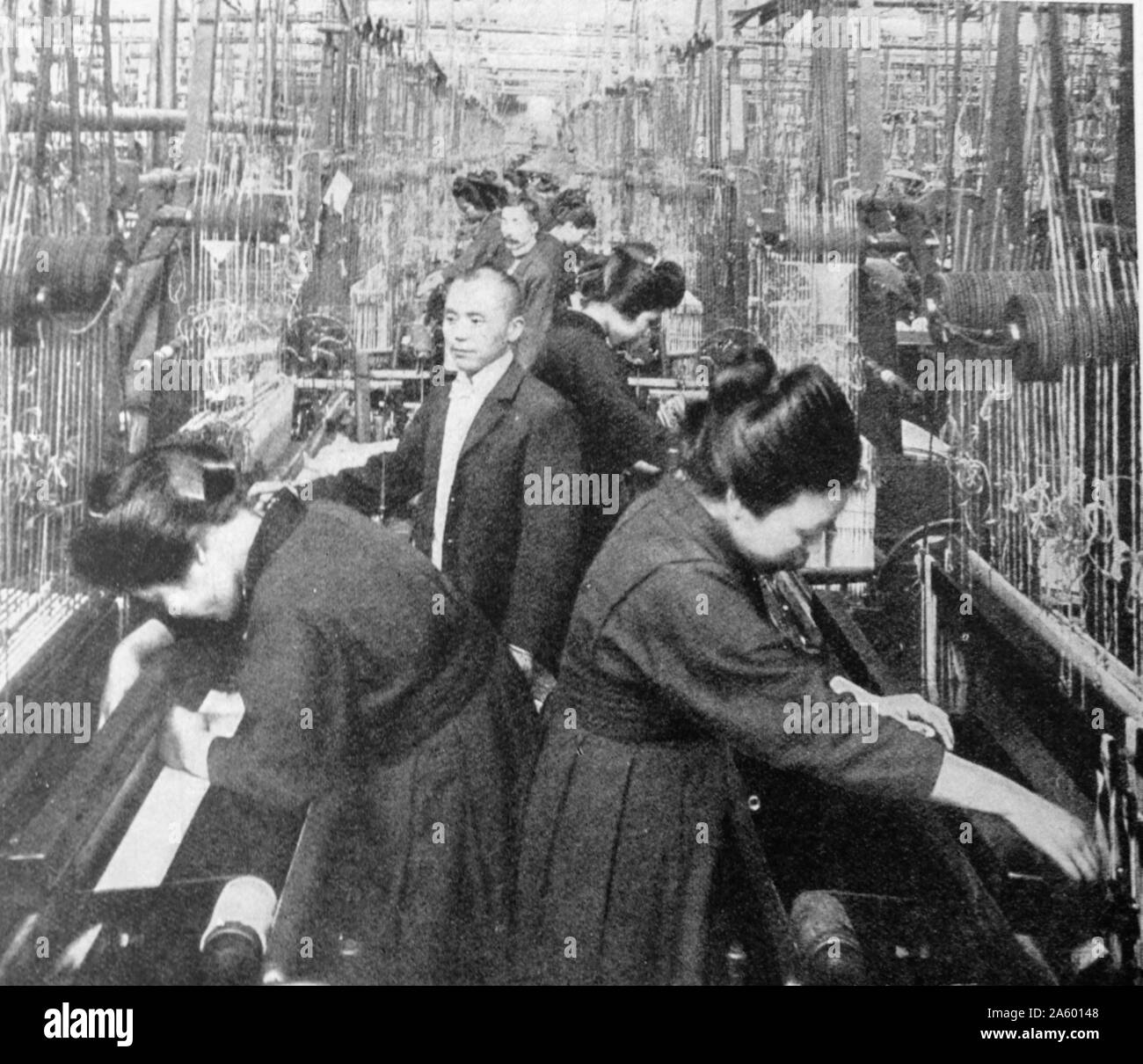 Photographic print of a busy silk factory in Japan Stock Photo