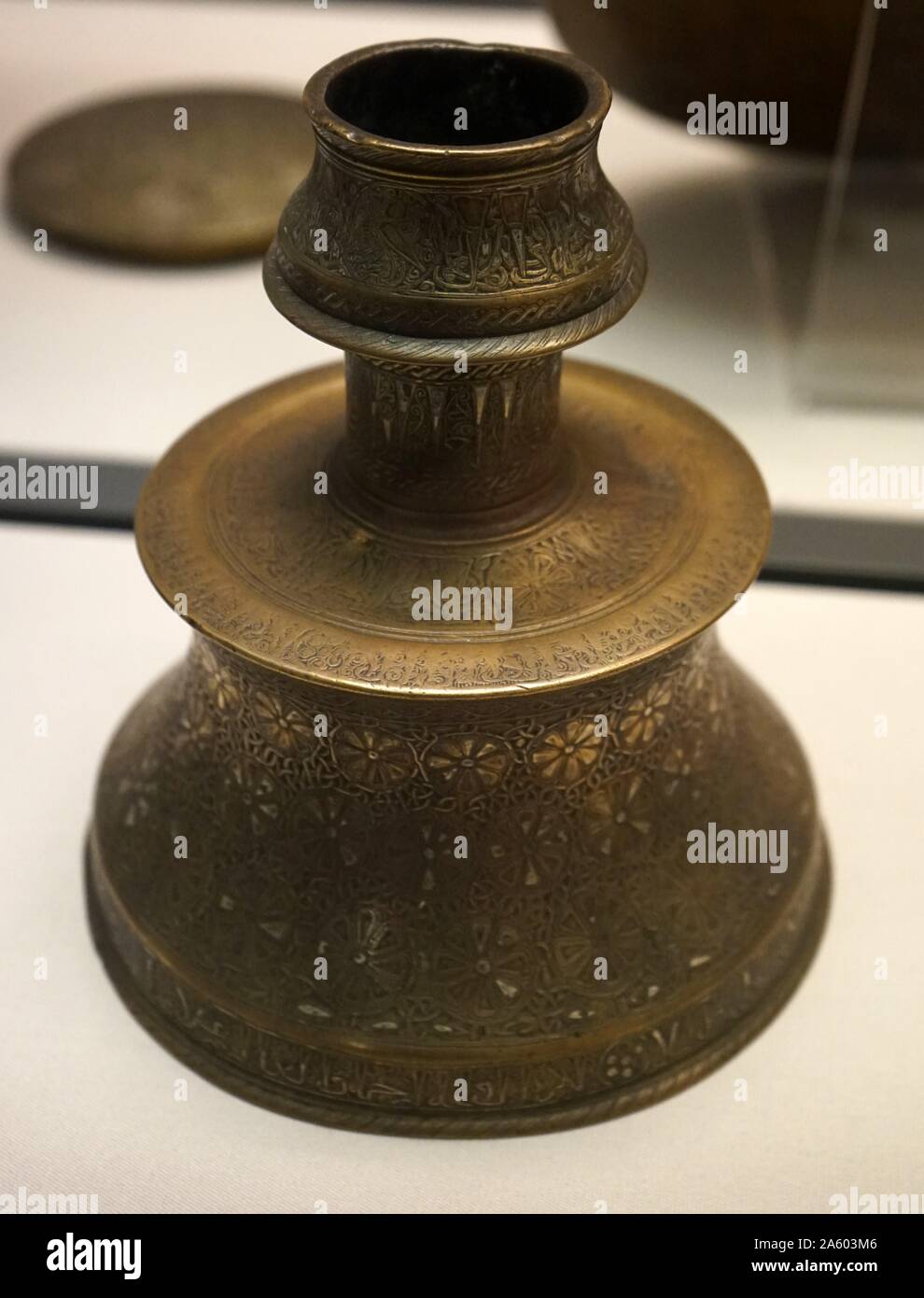 Brass candlesticks with an Arabic inscription blessing the owner. Dated 14th Century Stock Photo