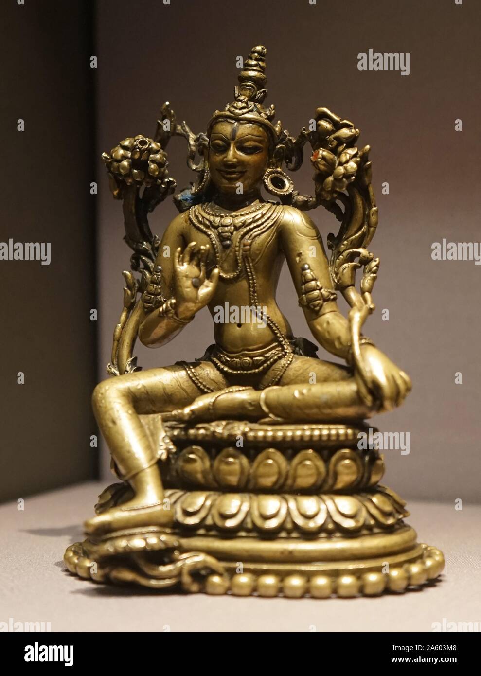 Bronze seated figures of Avalokiteshvara, the earthly manifestation of the self-born eternal Buddha Amitabha. Dated 12th Century Stock Photo