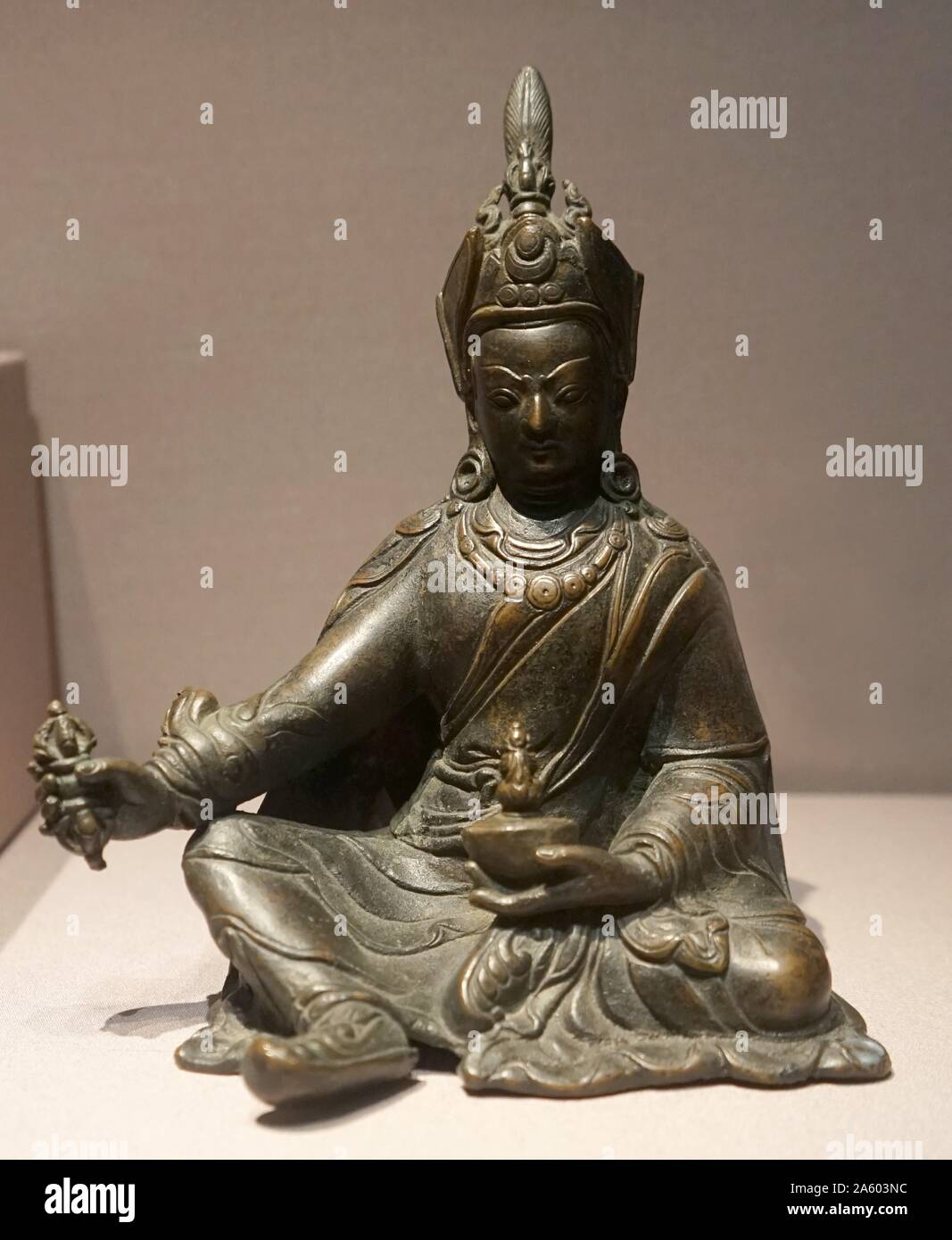 Bronze seated figures of Avalokiteshvara, the earthly manifestation of the self-born eternal Buddha Amitabha. Dated 12th Century Stock Photo