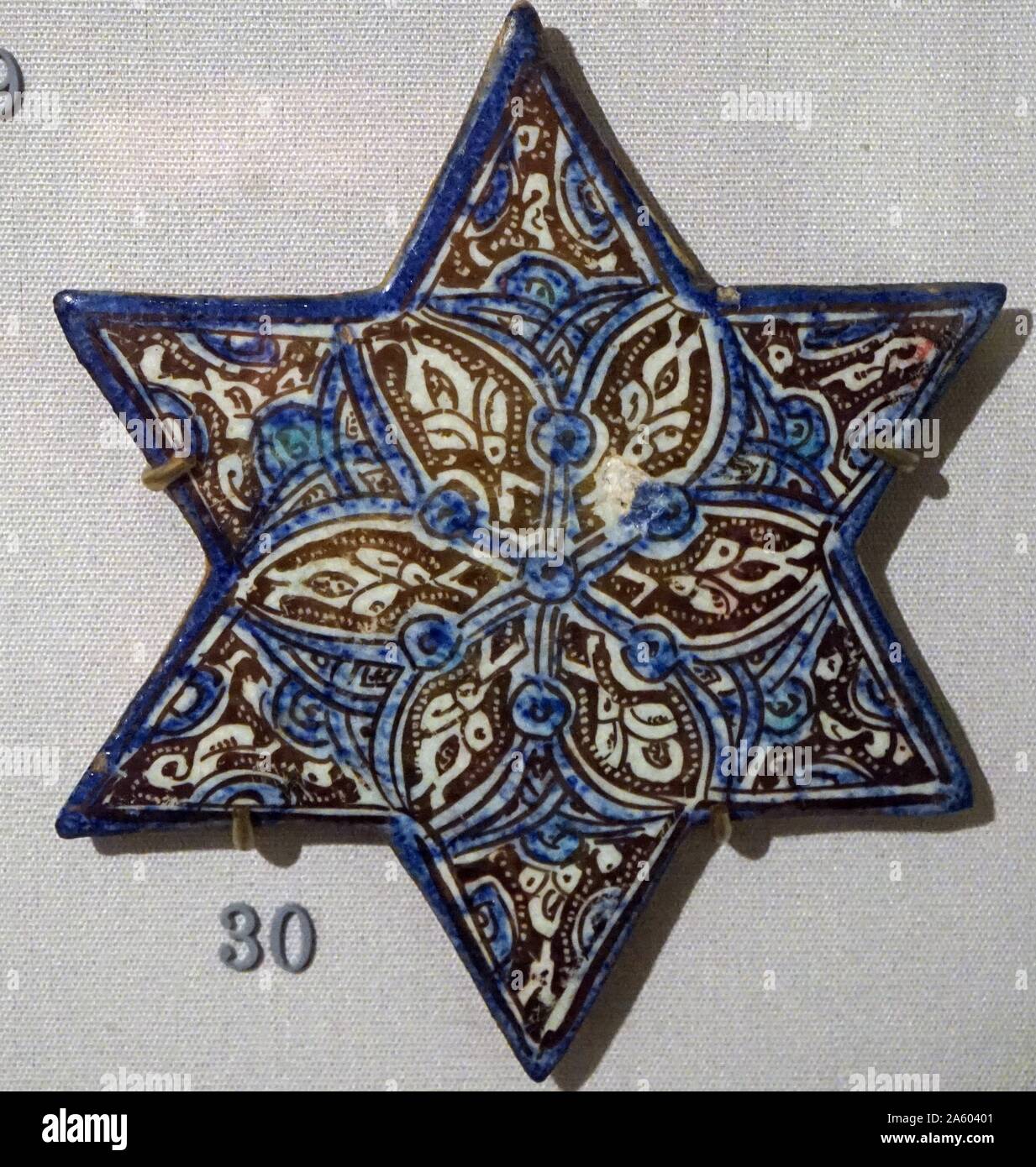 Lustre star tiles with cobalt and turquoise, from Iran, Kashan. Dated 13th Century Stock Photo