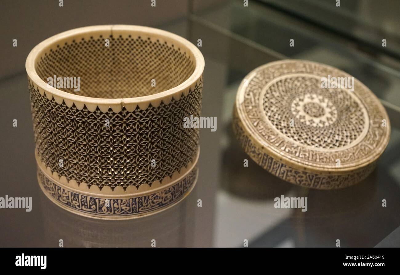 Ivory box and lid from two separate objects, with an inscription of Arabic poetry. Dated 14th Century Stock Photo
