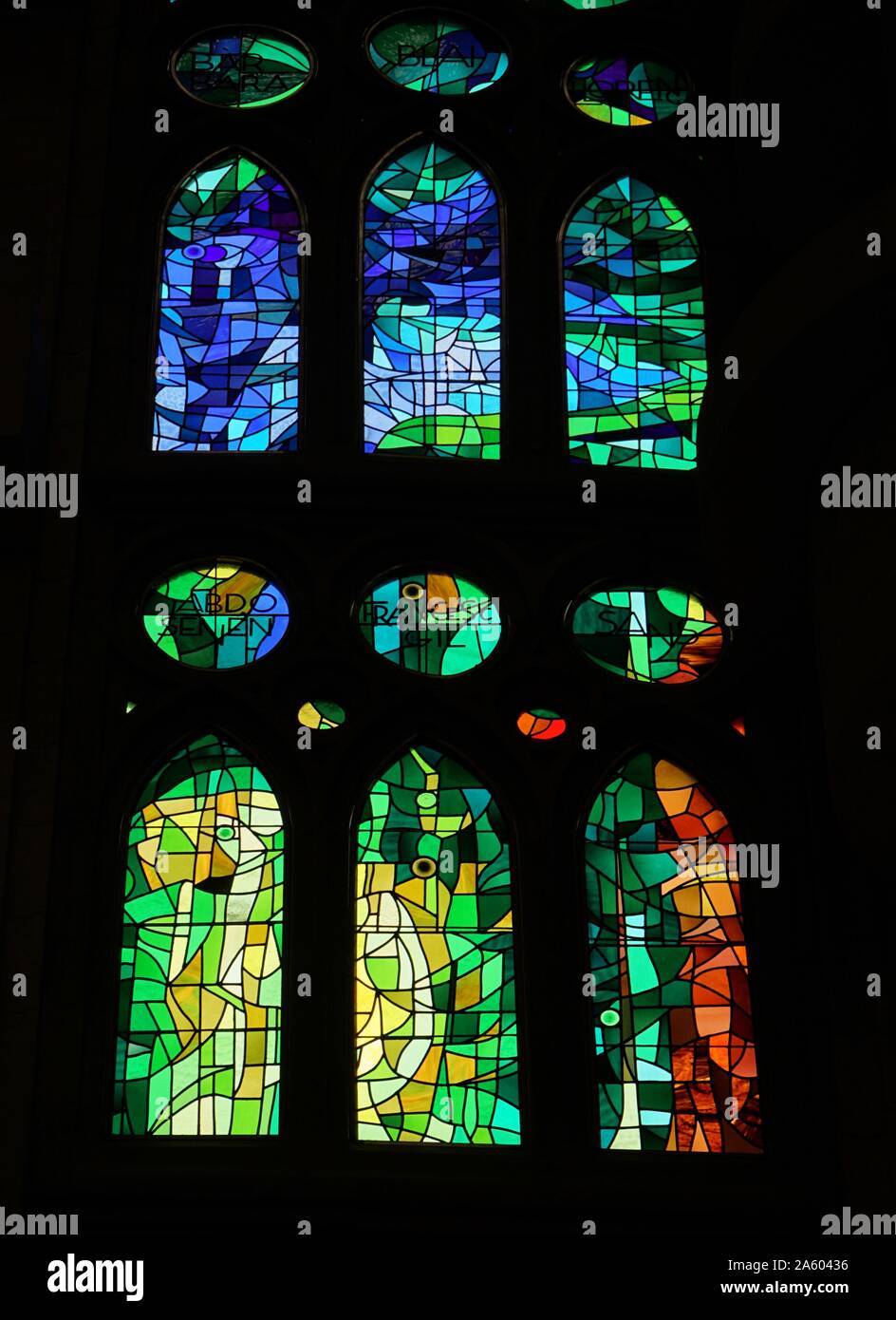 Stained glass window at the Basílica i Temple Expiatori de la Sagrada Família, a Roman Catholic church in Barcelona, designed by Spanish architect Antoni Gaudí (1852–1926). Dated 21st Century Stock Photo
