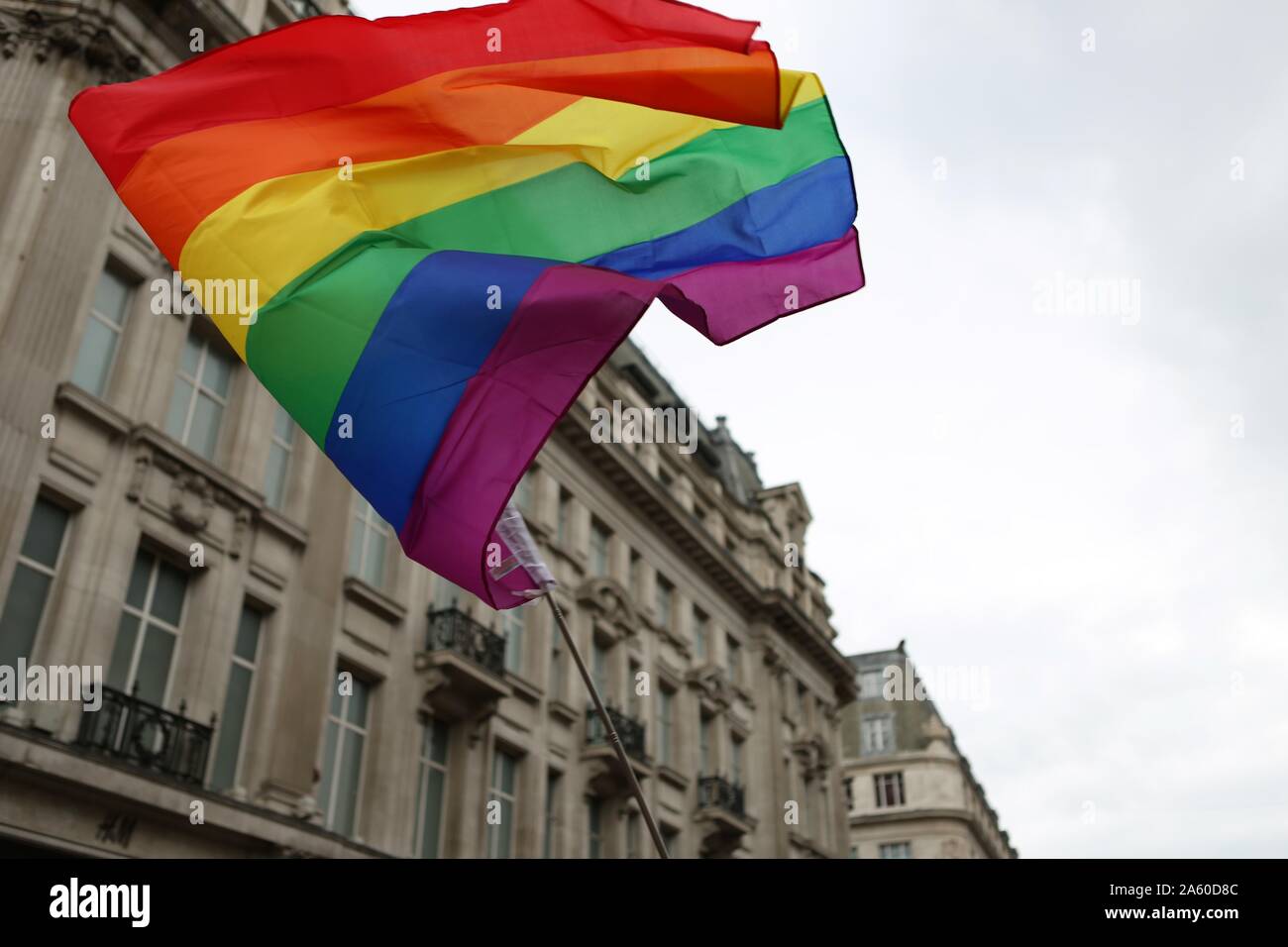 London, UK. 6th July, 2019. Pride Flag flying during the parade.The 50th Pride Parade toke place through Central London with over one million participants. Credit: Pietro Recchia/SOPA Images/ZUMA Wire/Alamy Live News Stock Photo