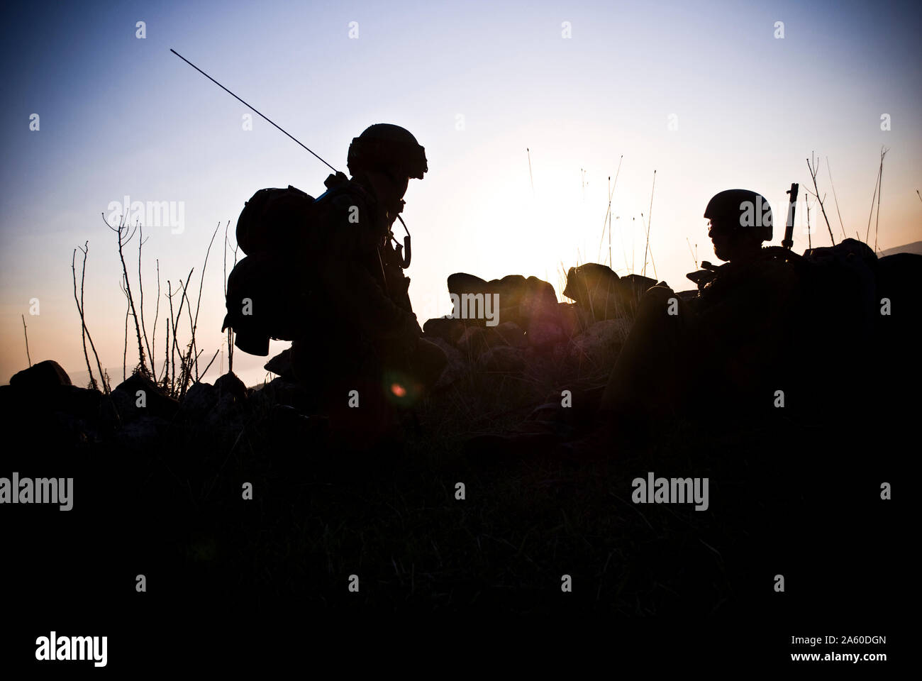 A silhouette of the military person on a background of a sunset Stock Photo
