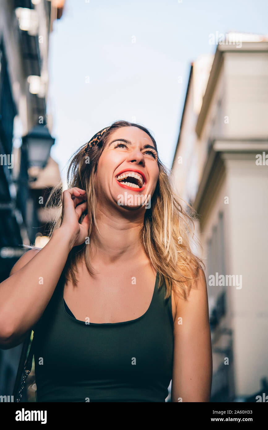 Portrait of laughing woman in the city Stock Photo