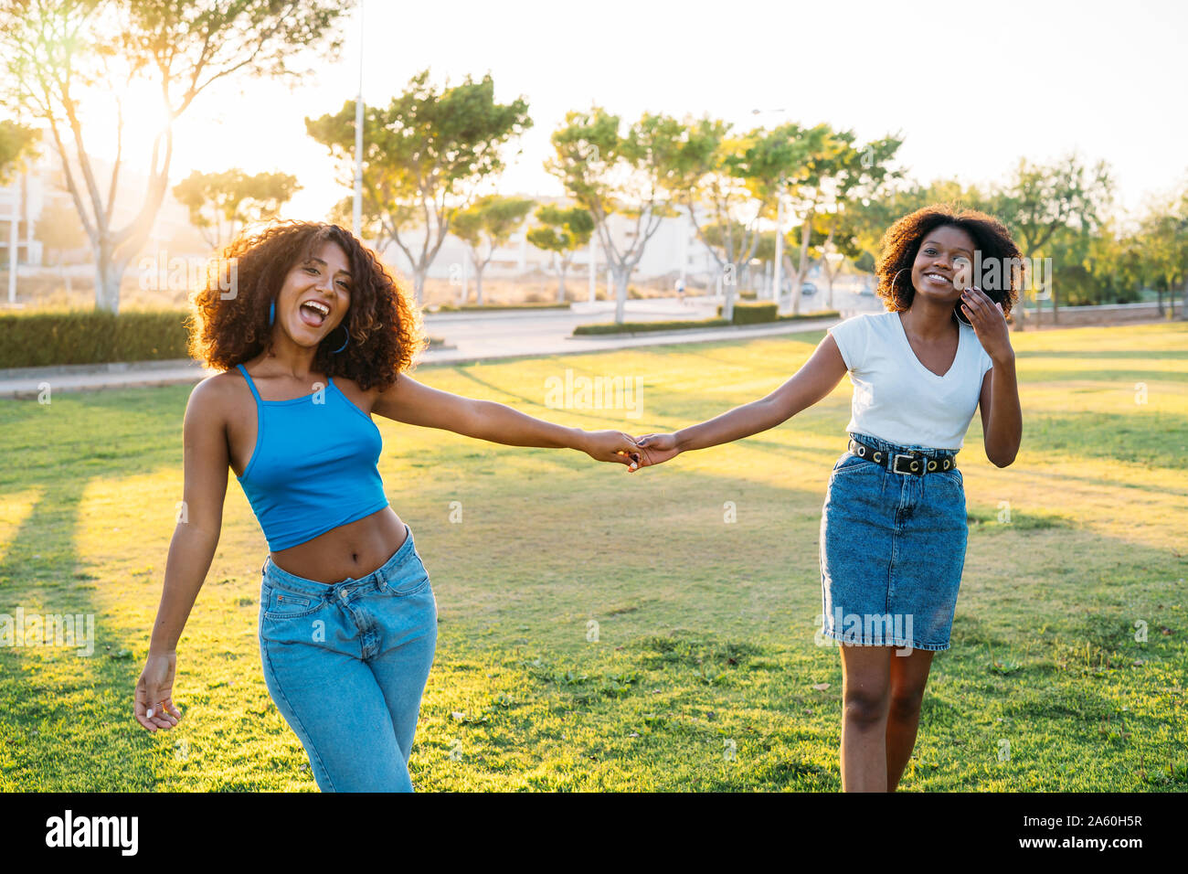 Portrait of two best friends having fun together in the evening Stock Photo