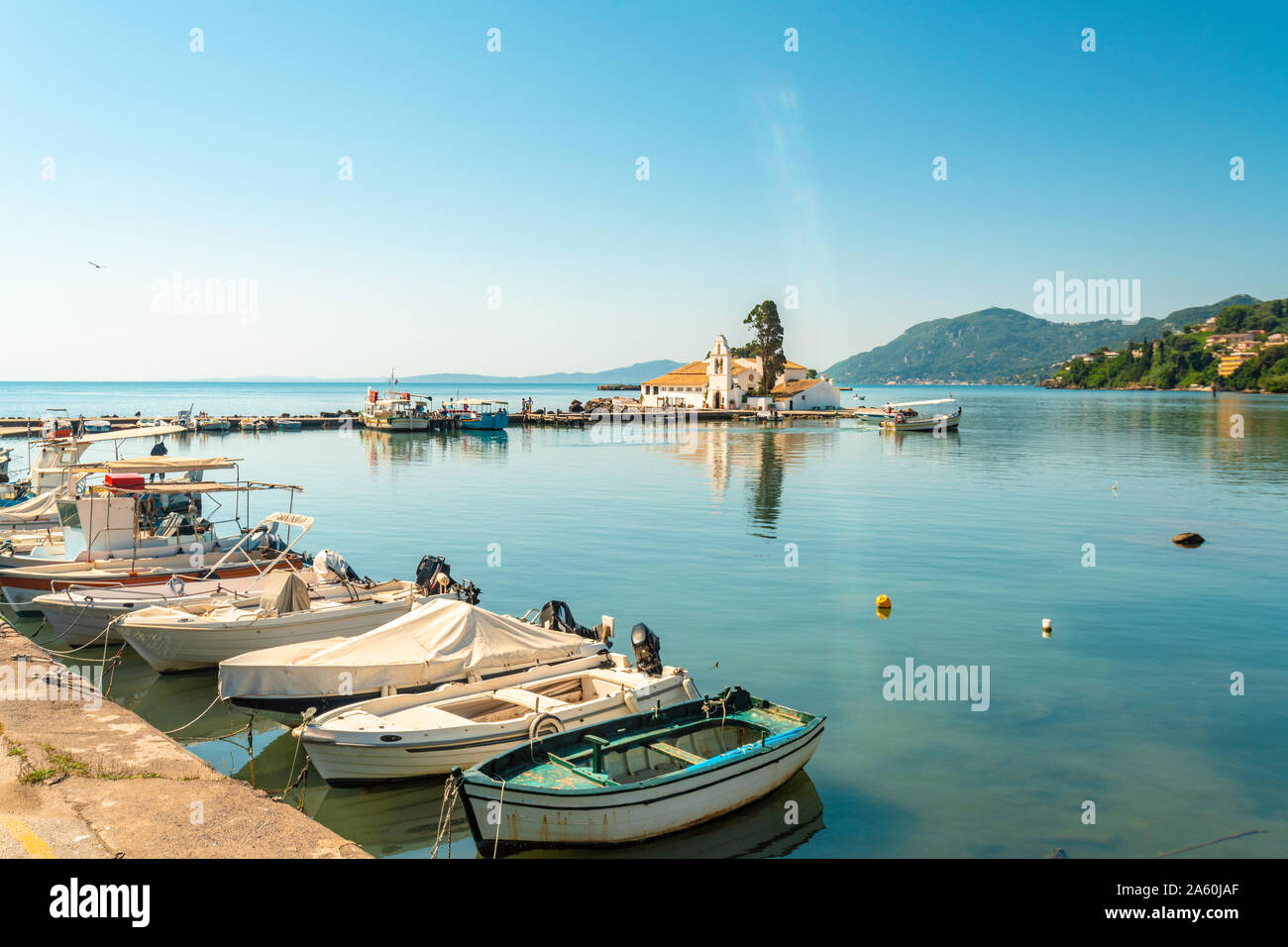 Boats moored at marina against sky at Corfu, Greece Stock Photo