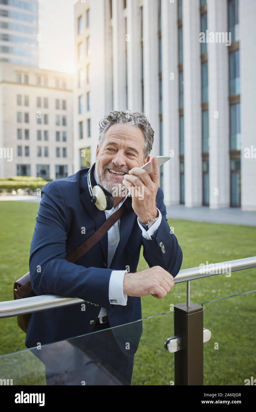 Mature businessman using smartphone in the city Stock Photo