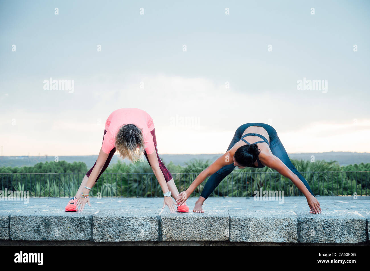 Woman teaching yoga to senior woman Stock Photo
