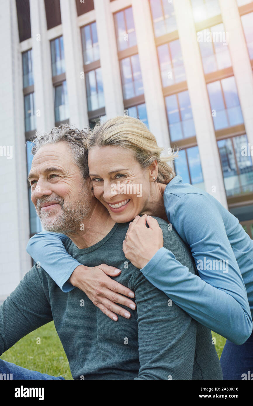 Happy mature couple hugging in the city Stock Photo