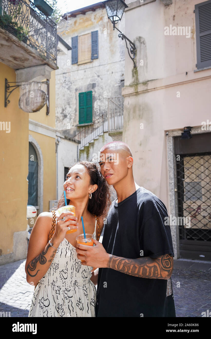 Portrait of young couple discovering the city, Lecco, Italy Stock Photo
