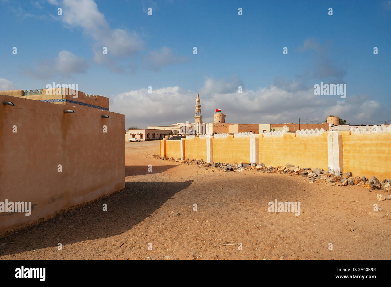 Sultanate Of Oman, Ras al Hadd, Ras al Hadd Castle with Omani flag and minaret Stock Photo
