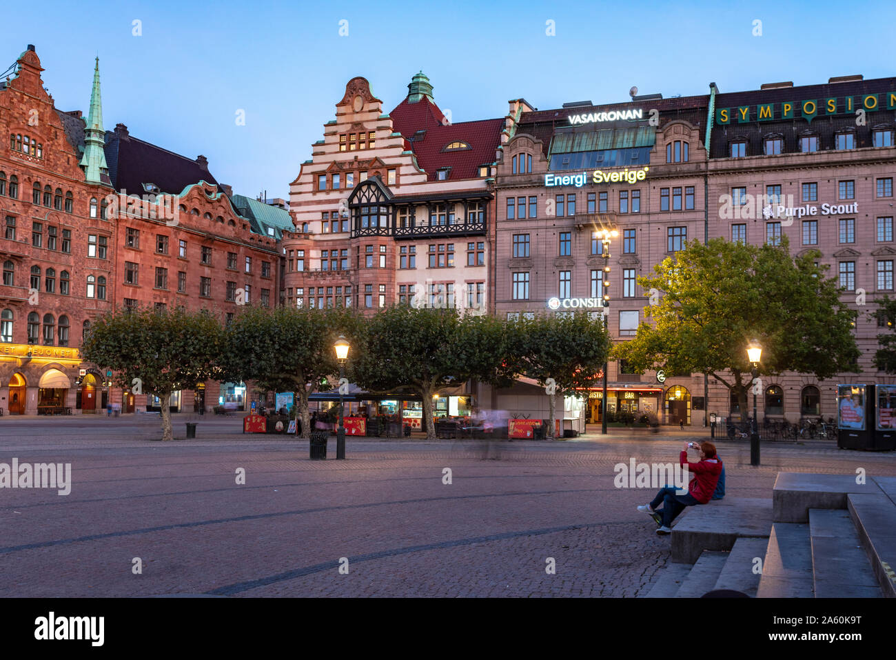 Buildings at city square at dusk in Malmo, Sweden Stock Photo