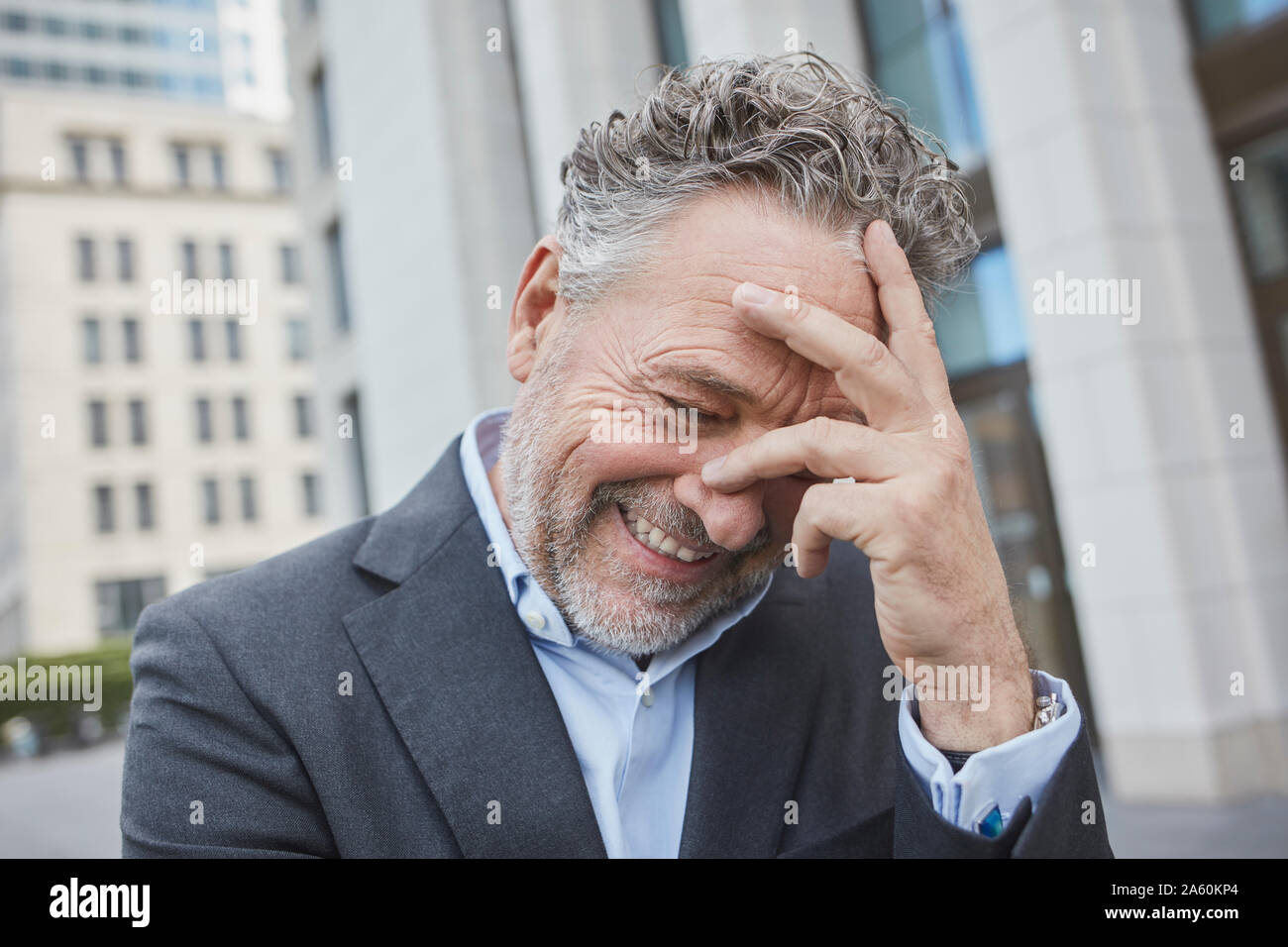 Portrait of happy businessman in the city Stock Photo