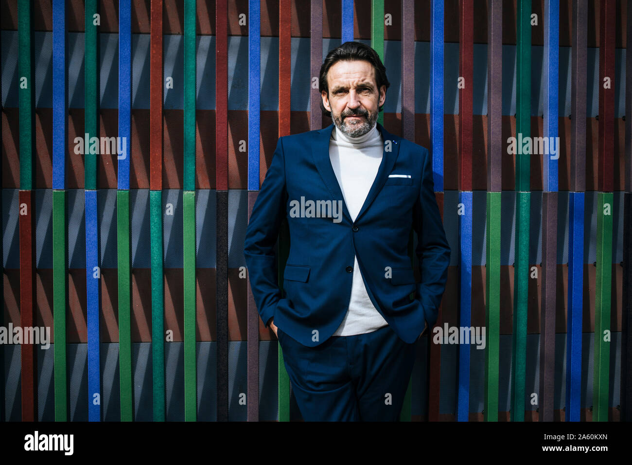 Portrait of mature businessman wearing blue suit Stock Photo - Alamy