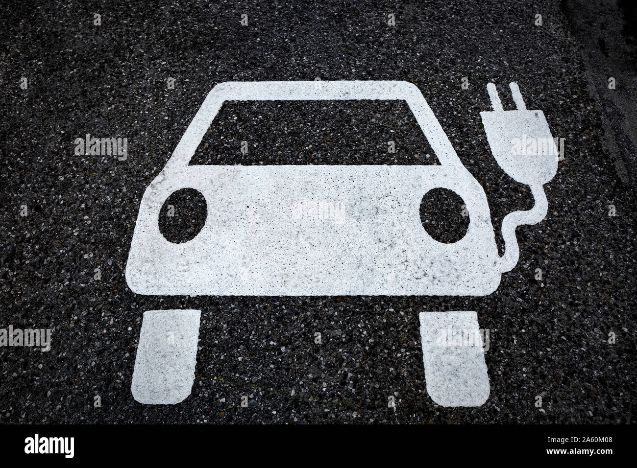 Symbol for a charging ststion for electric vehicles on tarmac Stock Photo