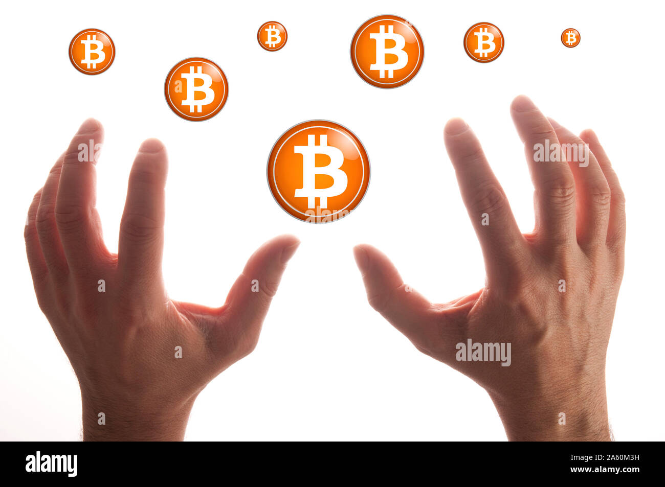 hands grabbing bitcoins Stock Photo