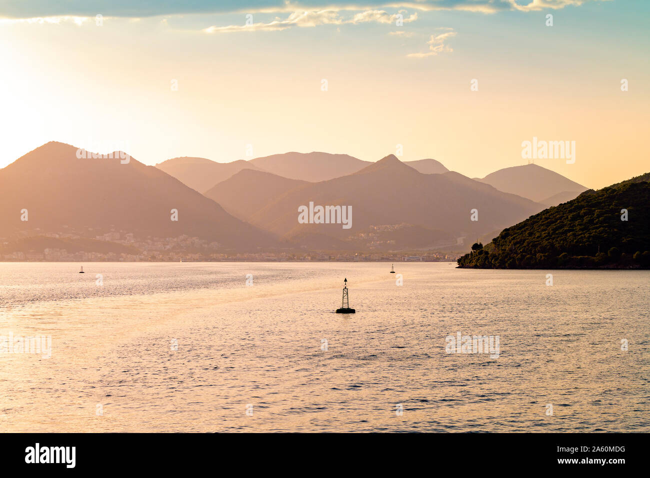 Scenic view of sea by mountains against sky at Corfu, Greece Stock Photo