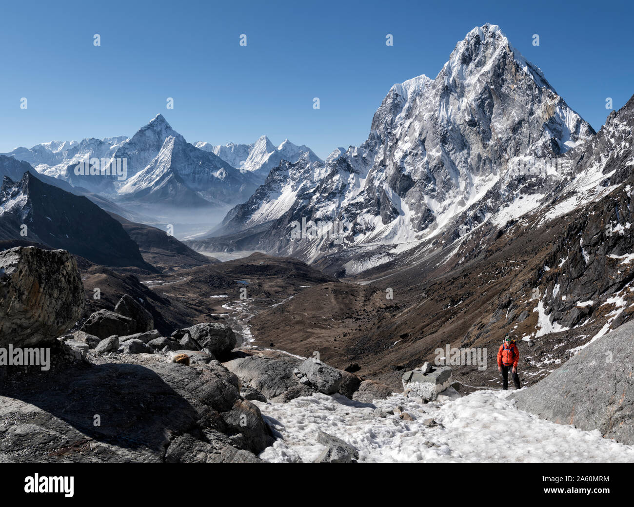 Young woman hiking in Sagarmatha National Park, Everest Base Camp trek, Nepal Stock Photo