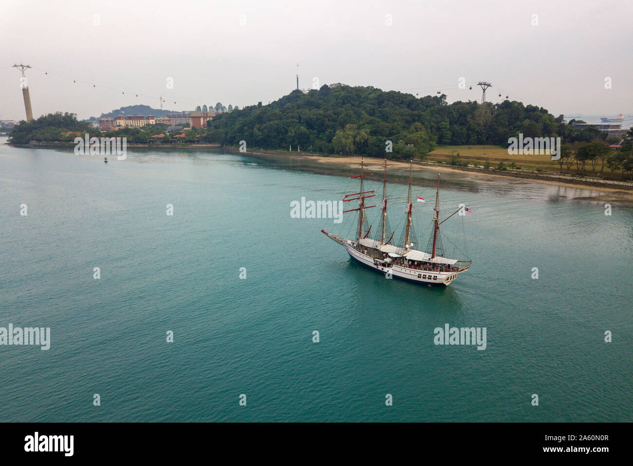Aerial view of a sailing boat entering Keppel Bay, Singapore Stock Photo
