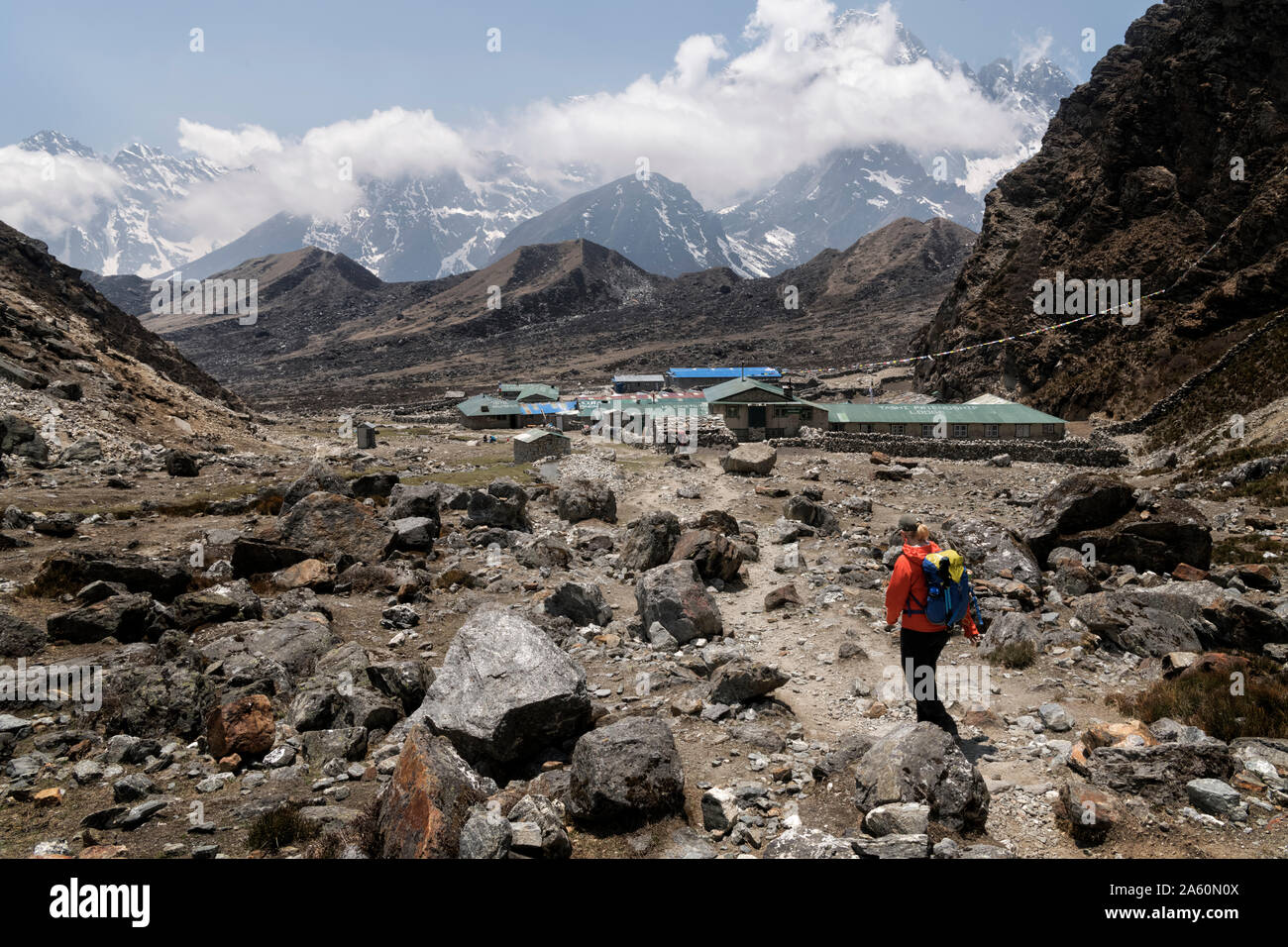 Young woman hiking in Sagarmatha National Park, Everest Base Camp trek, Nepal Stock Photo