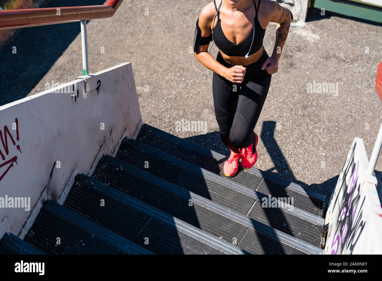 Black woman running headphones hi-res stock photography and images - Alamy