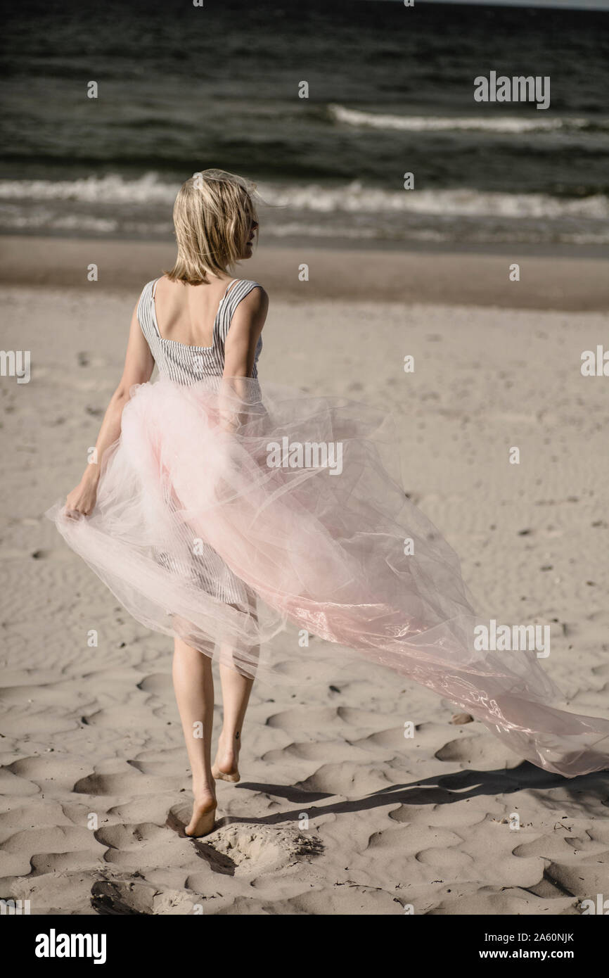 Back view of blond young woman hi-res stock photography and images - Alamy