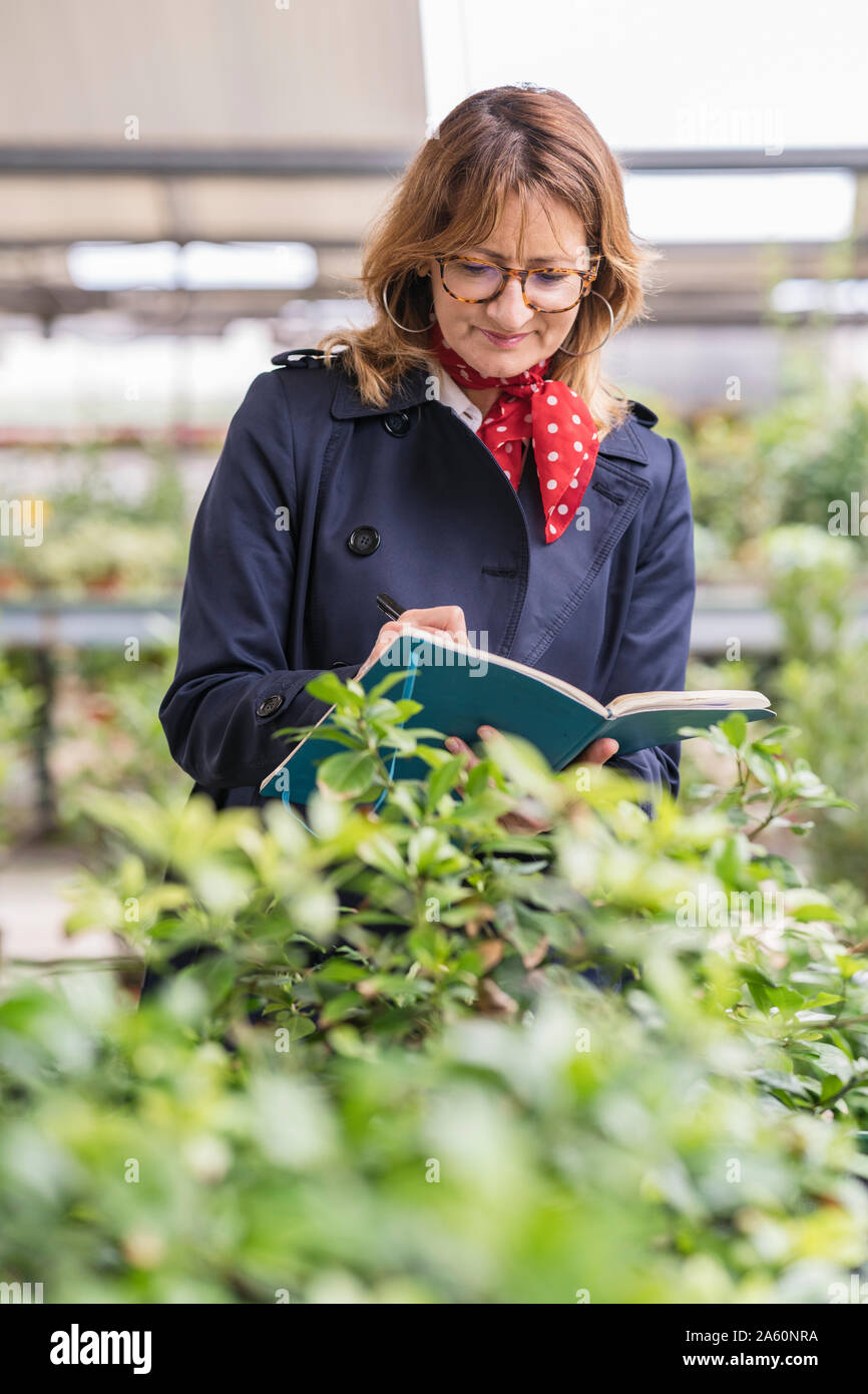Female manager working in a plant nursery Stock Photo Alamy