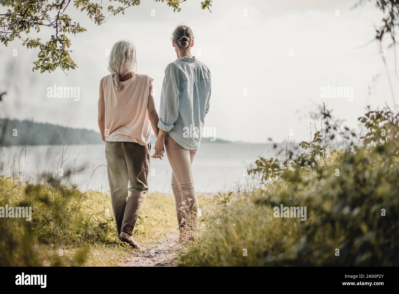 Mother and daughte holding hands at the Stock Photo