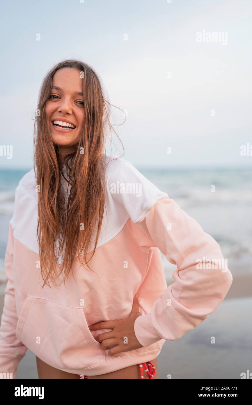 Portrait of happy young woman on the beach Stock Photo - Alamy