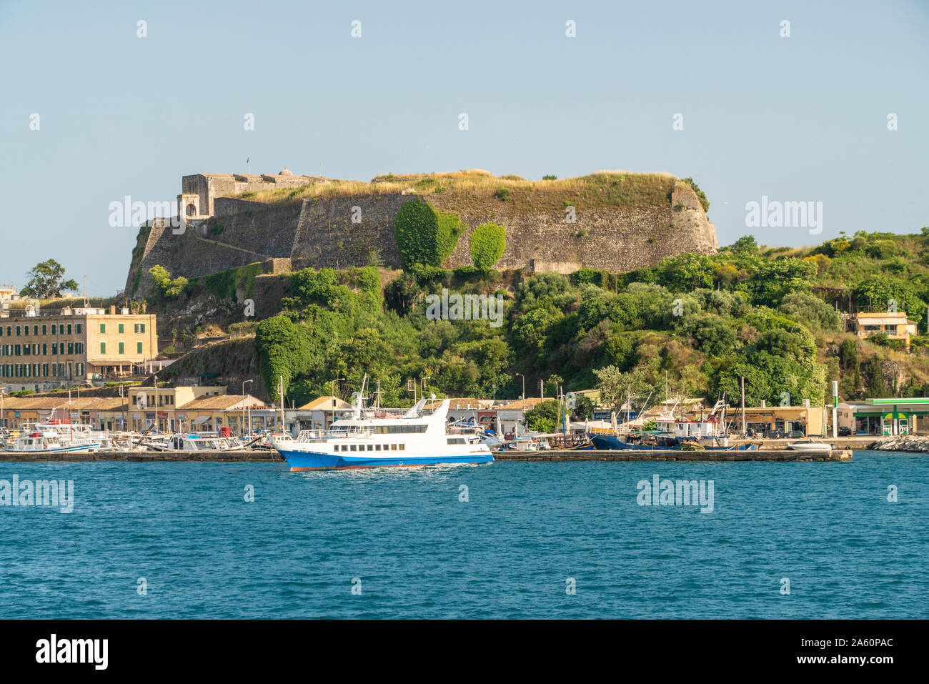 Ship moored at harbor against clear sky in Corfu, Greece Stock Photo