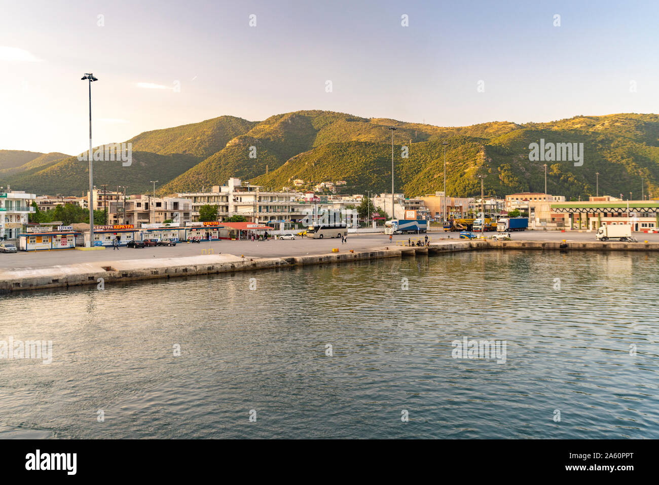 Scenic view of buildings by sea against mountains in Corfu, Greece Stock Photo