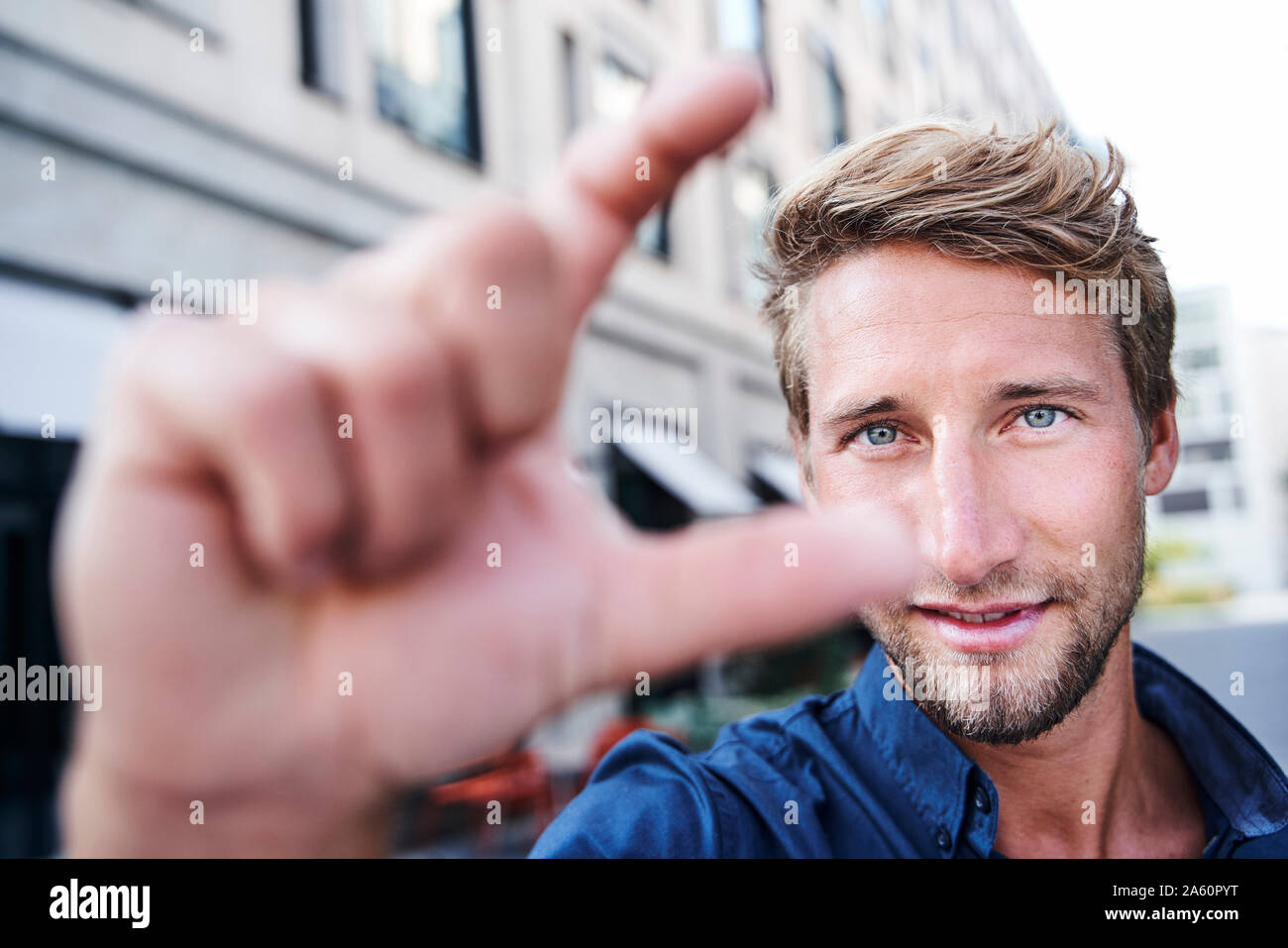 Portrait of young man gesticulating Stock Photo