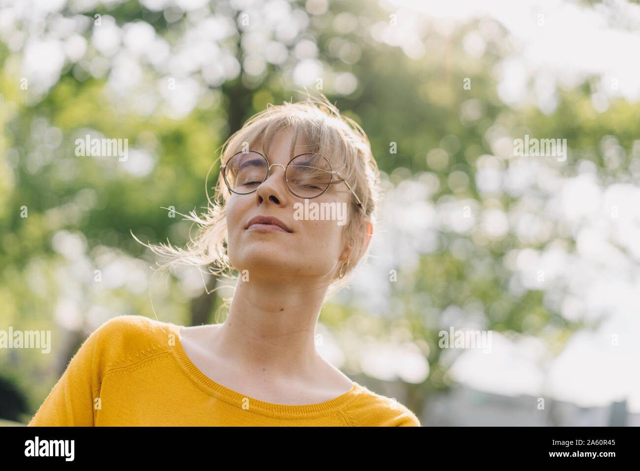 Portrait of young woman with closed eyes Stock Photo - Alamy