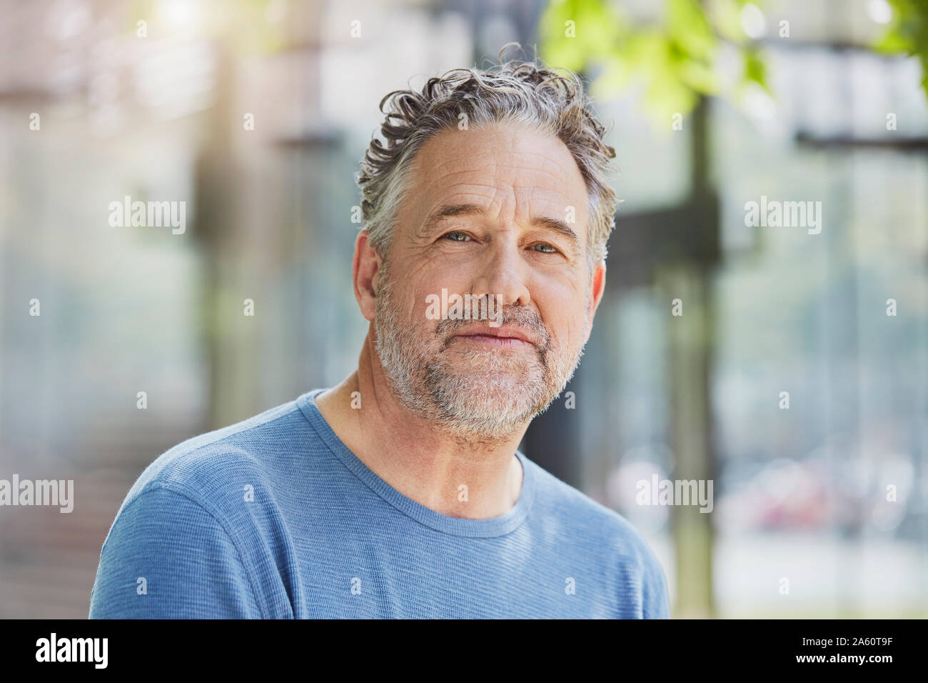 Portrait of mature man in a park Stock Photo