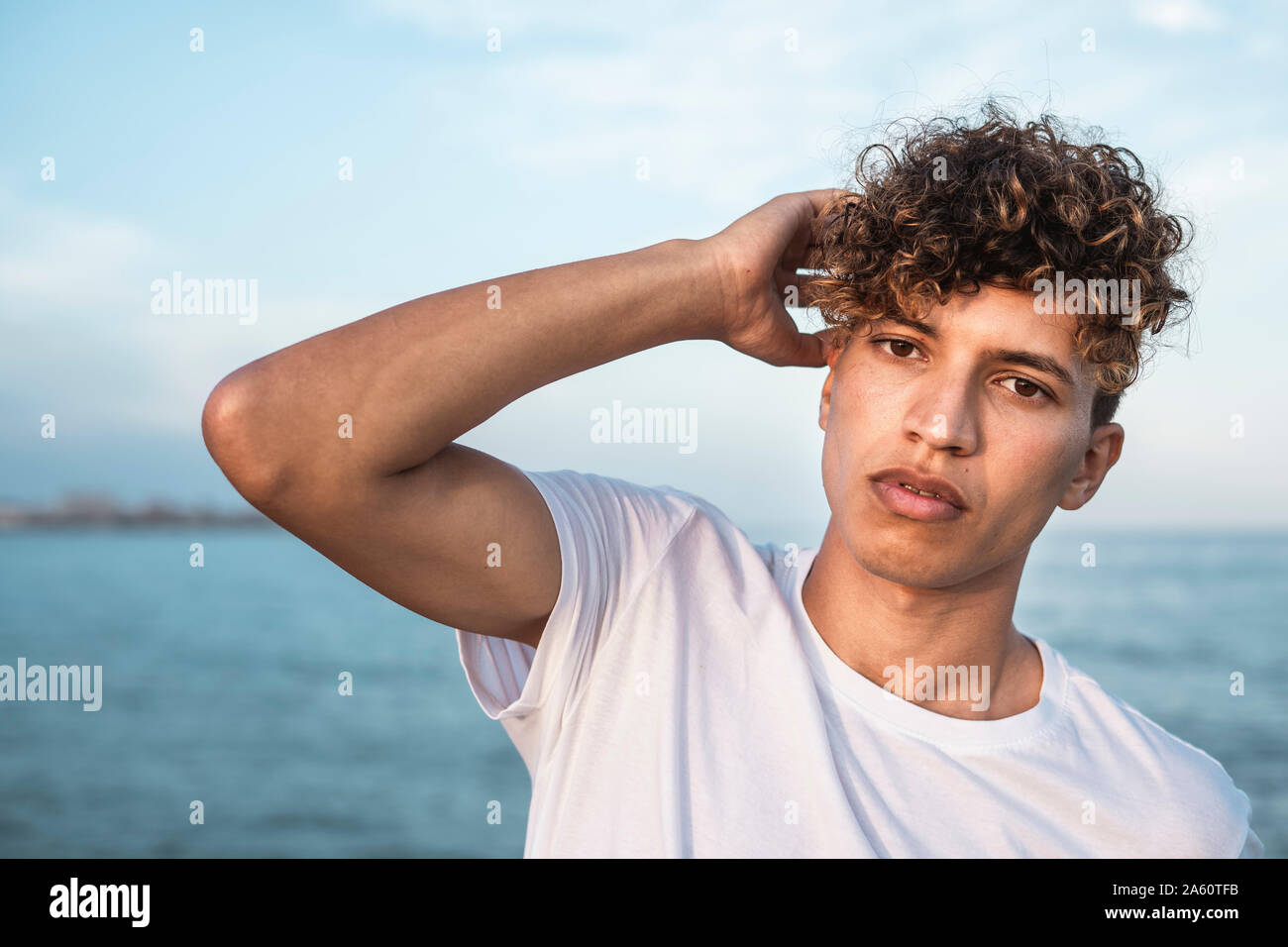 Young curly man hi-res stock photography and images - Alamy