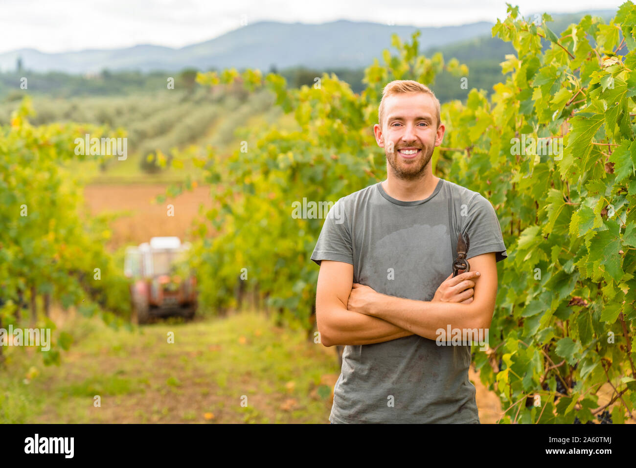 Portrait of confident young man in vineyard Stock Photo - Alamy