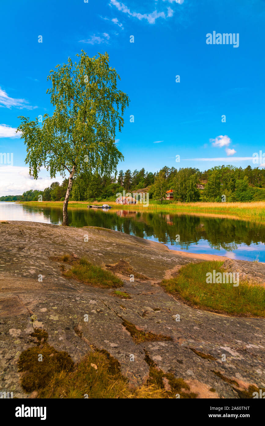 Scenic view of river and landscape against blue sky in Loftahammar, Sweden Stock Photo