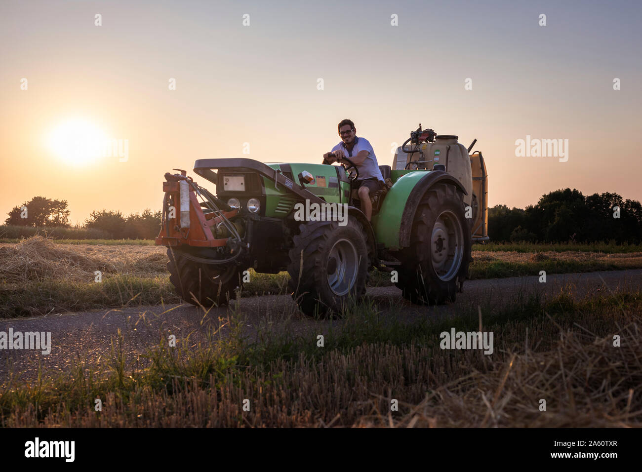 Farmer on a tractor hi-res stock photography and images - Alamy