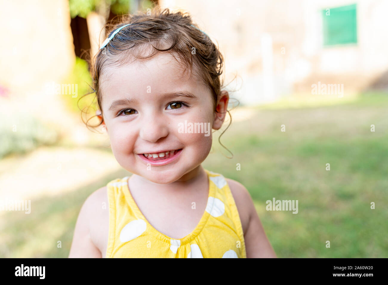 Portrait of a smiling little girl outdoors in summer Stock Photo - Alamy