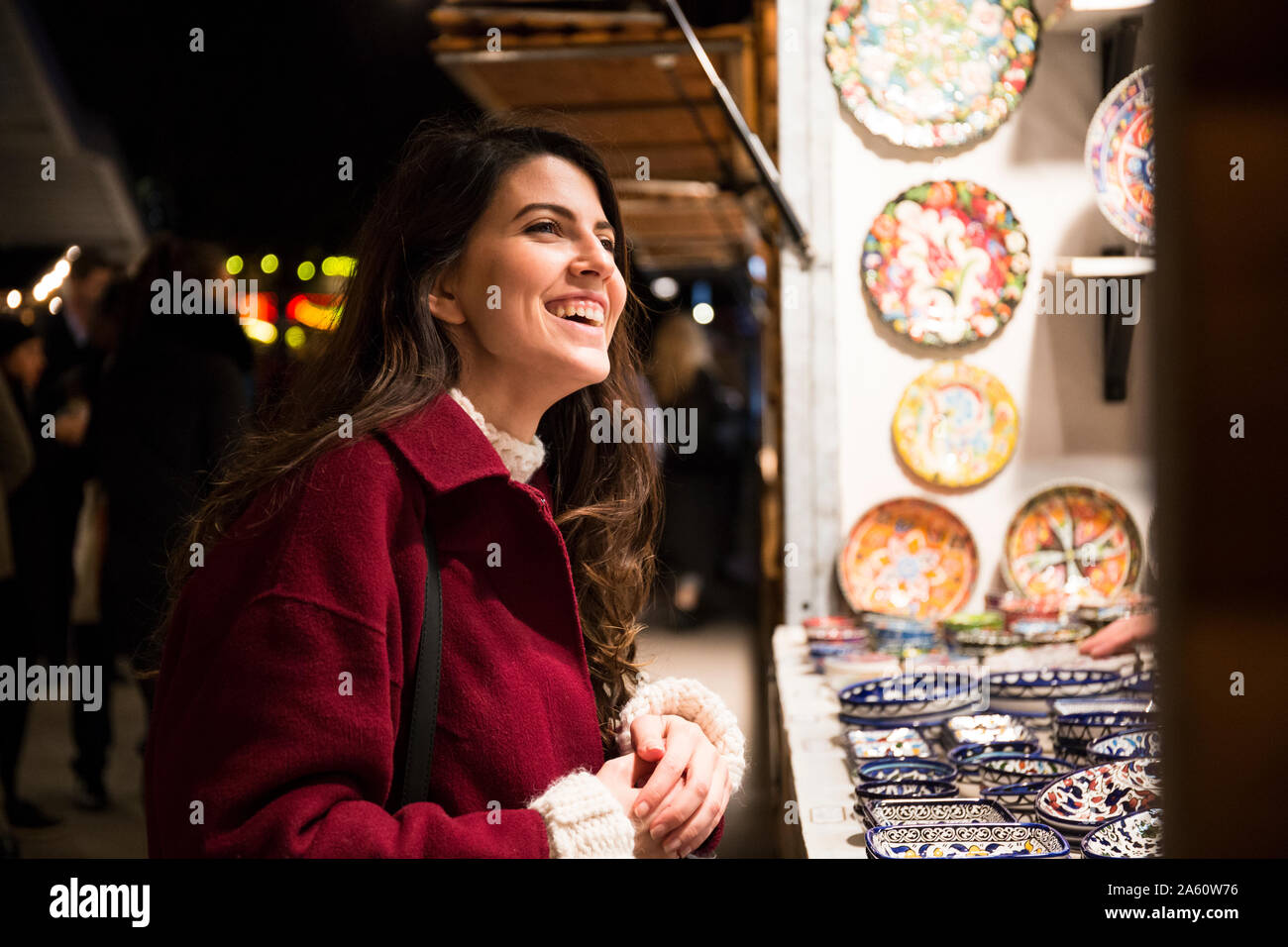 Portrait of laughing young woman on Christmas market Stock Photo